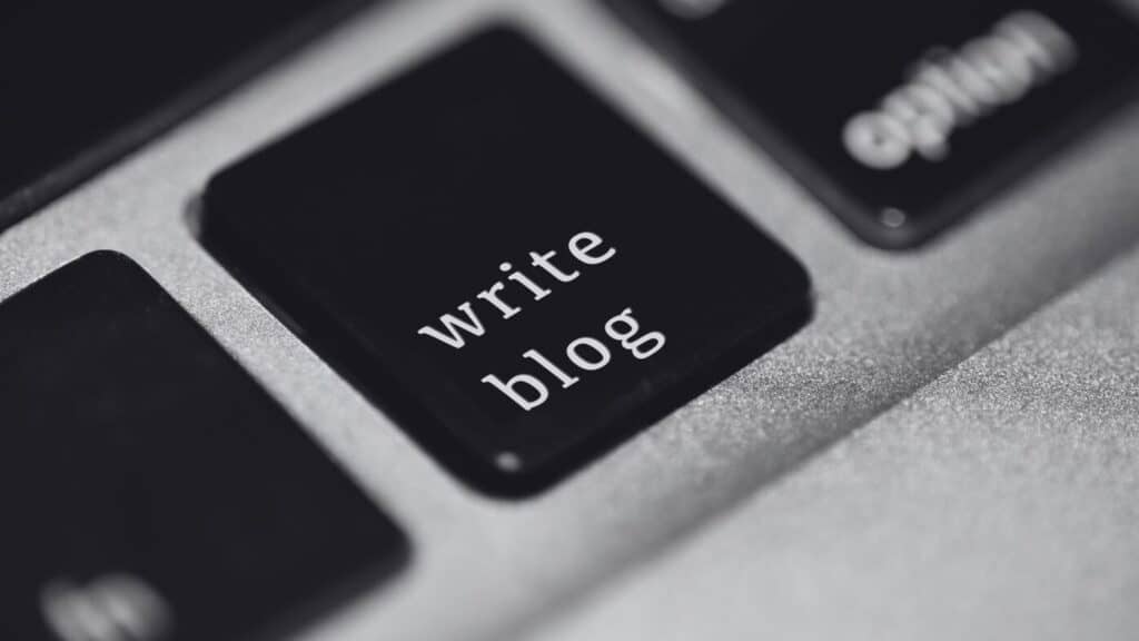 Keyboard with button saying 'write blog'